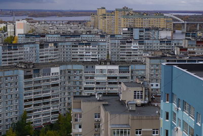 High angle view of residential buildings against sky