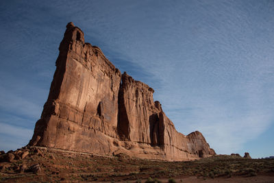 Low angle view of rock formations against sky