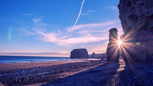 View of beach at sunset