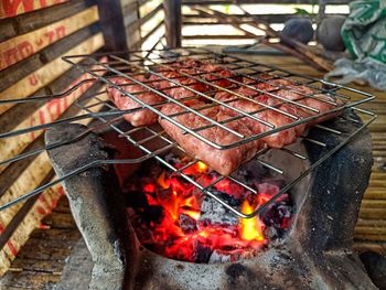 Close-up of meat on barbecue grill