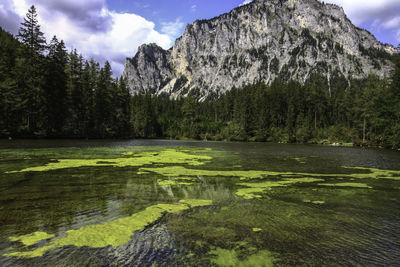 Scenic view of lake and mountains against sky