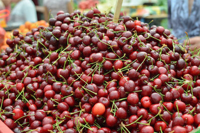 Ripe cherries on green market desk in spring