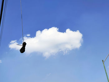 Low angle view of bird flying in sky