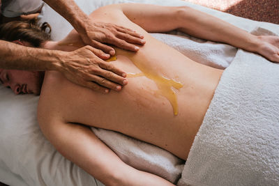 Therapist massaging customer in spa