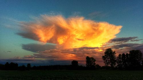 Scenic view of landscape against sky at sunset