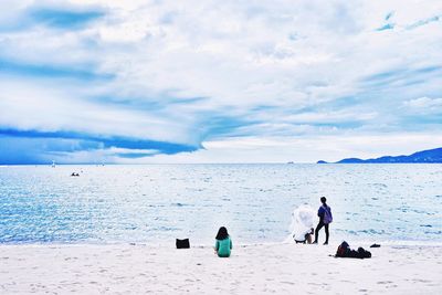 Scenic view of sea against cloudy sky