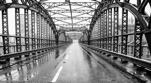 Bridge against sky in city