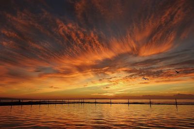 Scenic view of sea at sunset