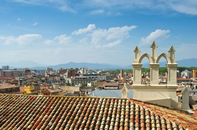 View of city buildings against sky