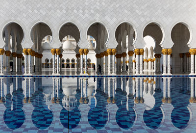 Reflection of building in swimming pool