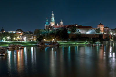 Wawel castle and vistula, wisla, river night panorama, krakow, poland
