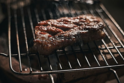 Close-up of meat on barbecue grill