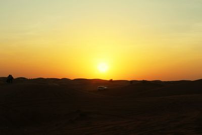 Scenic view of landscape at sunset