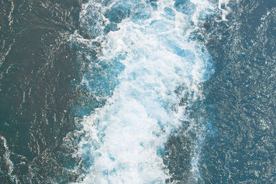 High angle view of water splashing in sea