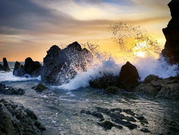 Scenic view of sea against cloudy sky