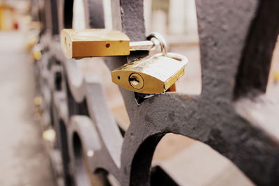 Close-up of padlocks on railing
