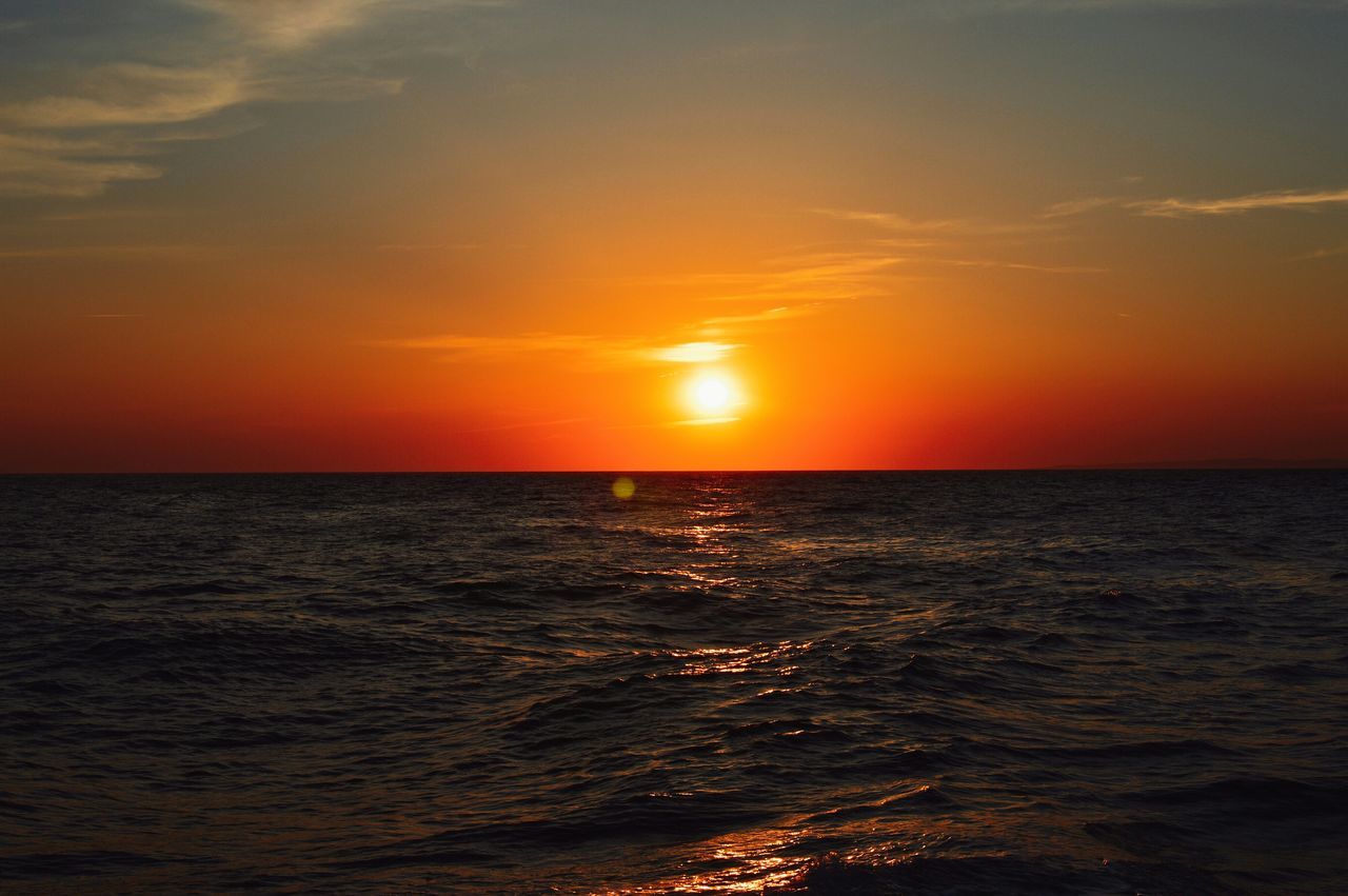 sunset, sea, water, horizon over water, scenics, tranquil scene, beauty in nature, waterfront, tranquility, sun, orange color, sky, idyllic, rippled, nature, seascape, reflection, sunlight, outdoors, no people