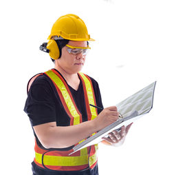 Low angle view of man working against white background