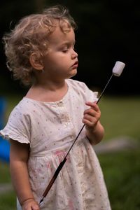Girl holding marshmallow