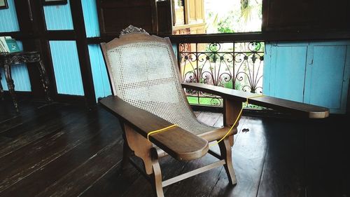 Empty chairs and table in house