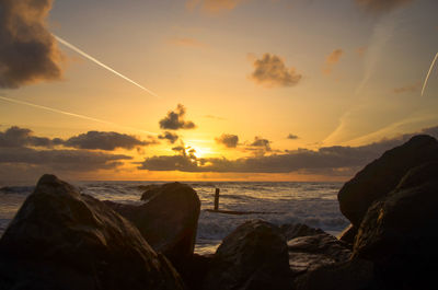 Destroyed sea defence at sunrise