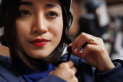 Close-up of young woman looking away