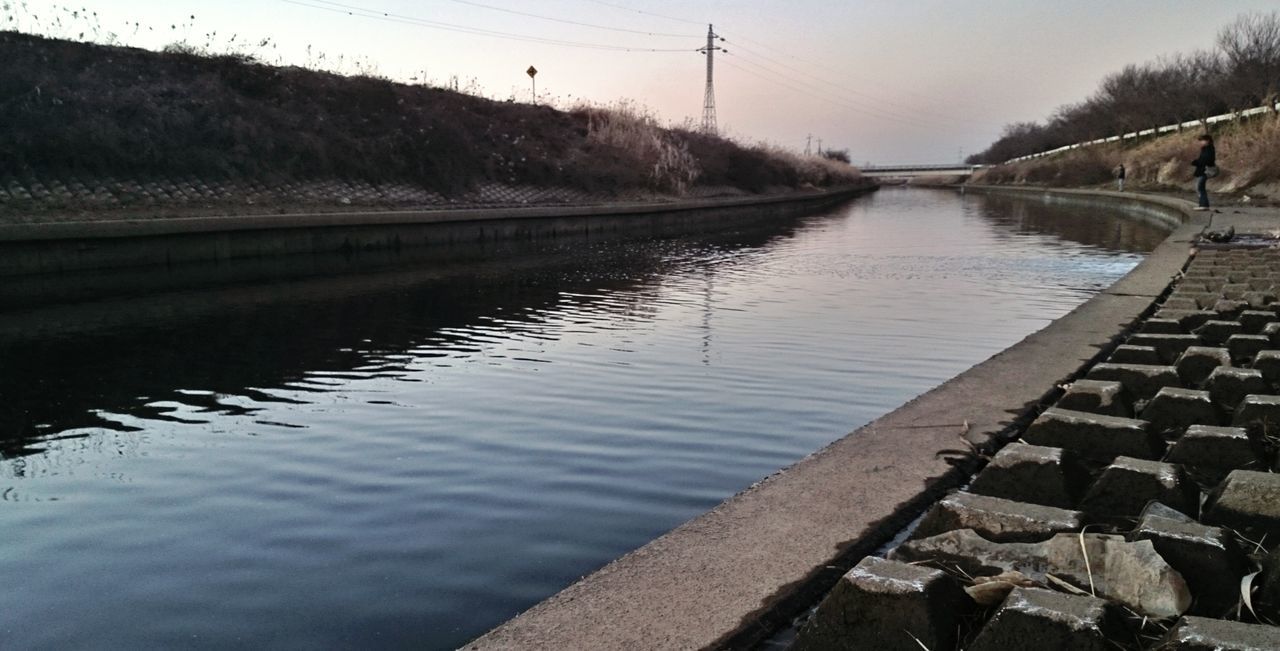 water, river, sky, connection, tranquility, tranquil scene, lake, nature, transportation, railing, built structure, day, clear sky, reflection, diminishing perspective, outdoors, scenics, the way forward, no people, bridge - man made structure