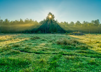 Scenic view of land against sky in morning light