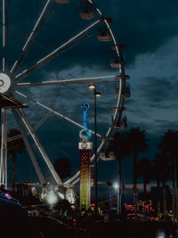 Illuminated ferris wheel at night