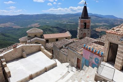 High angle view of buildings in city against sky