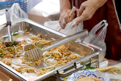 Cropped hand preparing food