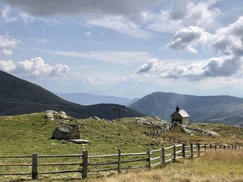 Scenic view of landscape and mountains against sky