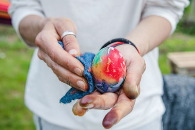 Close-up of hand holding ice cream