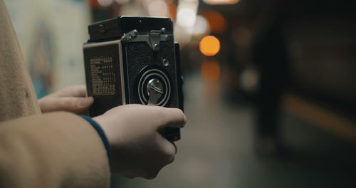 Close-up of hand holding camera