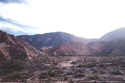 Scenic view of landscape and mountains against sky