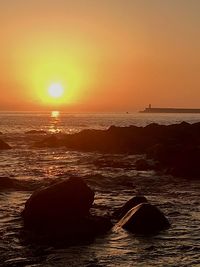 Scenic view of sea against sky during sunset