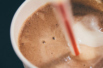 Close-up of drinking straw in hot chocolate