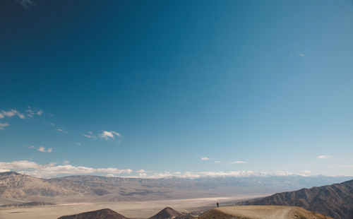 View of desert against blue sky