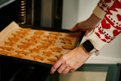 Cropped hand using laptop