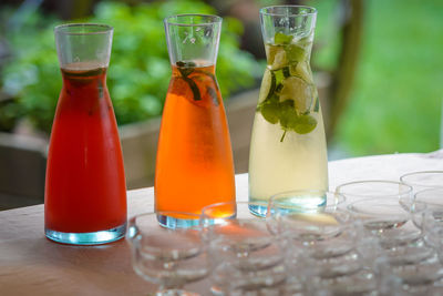 Close-up of colorful drinks in bottles on table