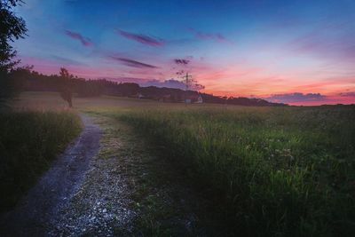 Scenic view of landscape against cloudy sky
