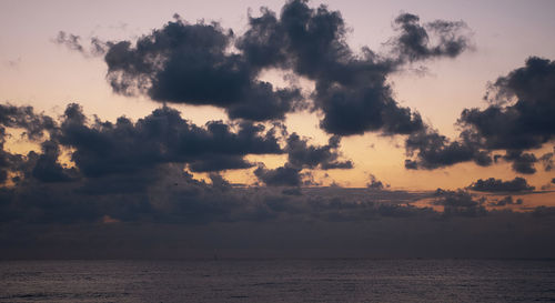 Scenic view of sea against sky at sunset