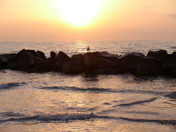 Scenic view of sea at sunset