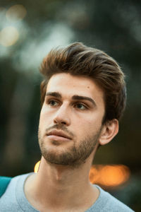 Close-up of young man looking away