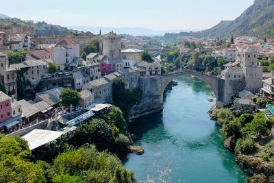 High angle view of river amidst buildings