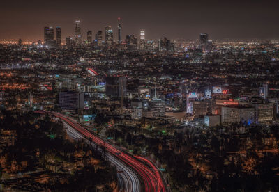 High angle view of illuminated cityscape at night