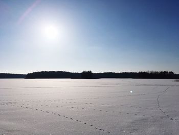 Scenic view of landscape against clear sky during winter