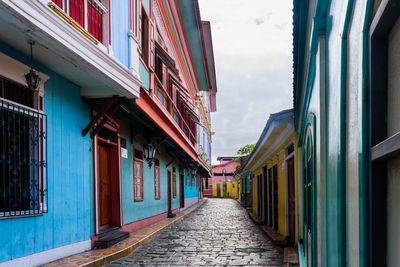 Multi colored houses against sky