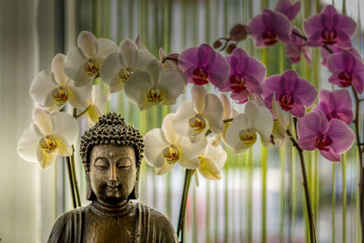 Close-up of statue of flowering plants