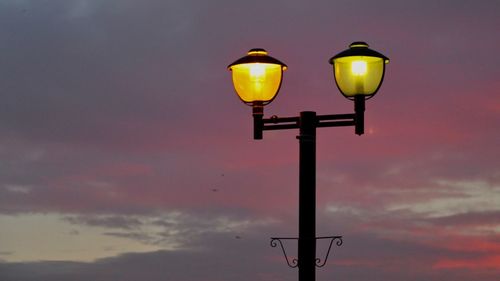 Low angle view of street light against sky